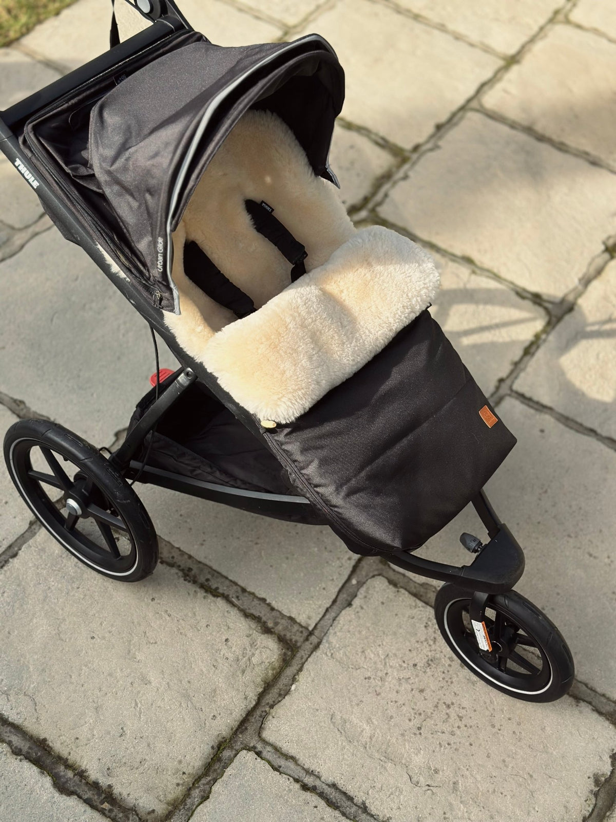 Pram sleeping bag inside a buggy