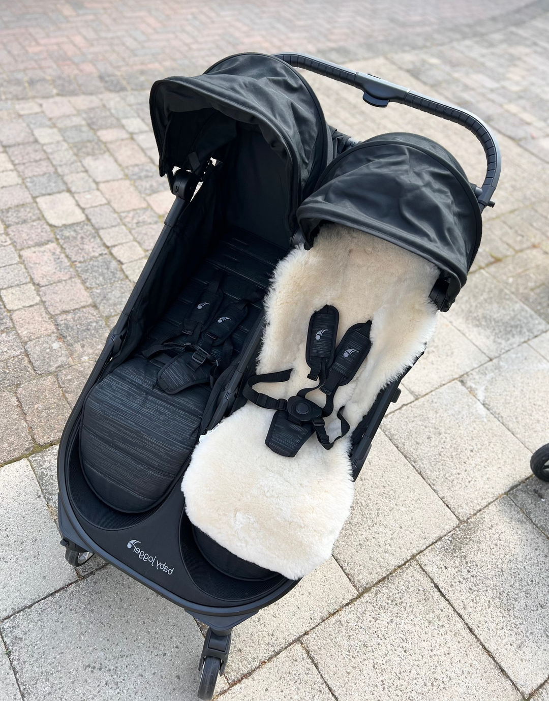 Baby Jogger Mini City duet tandem double pram with a sheepskin buggy liner fitted for comfort