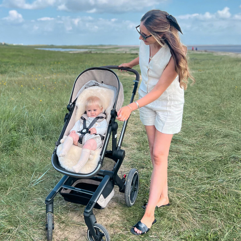 sheepskin buggy liner in a nuna triv pram