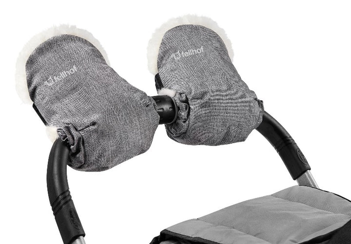 Sheepskin pram gloves  attached to the  handlebar of a pram with velcro fastening to save putting gloves on and off the 