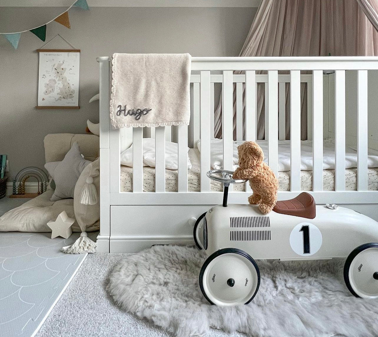 neutral coloured sheepskin rug in a natural nursery