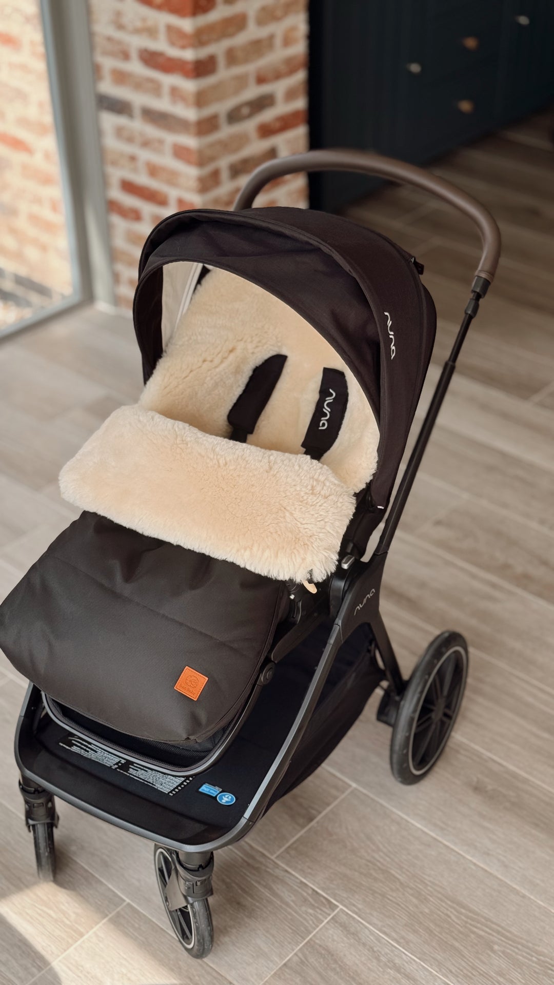 Sheepskin pram footmuff in the Nuna Triv pram