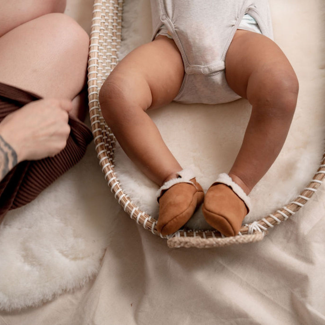 Baby booties in the colour Tan, made from the softest nappa lambskin with a luxuriously soft and fluffy inner