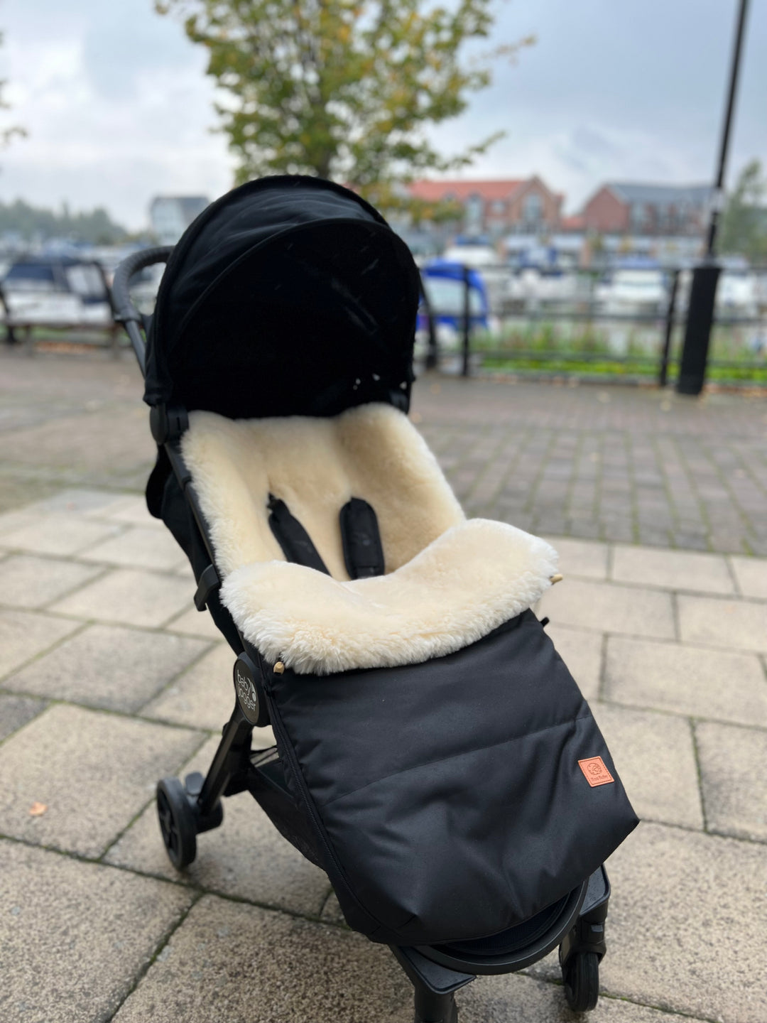 Baby jogger city mini tour with a sheepskin pram footmuff fitted