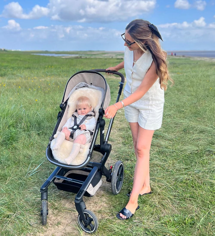 sheepskin liner to keep baby cool in warm spring and summer in an egg pram on holiday