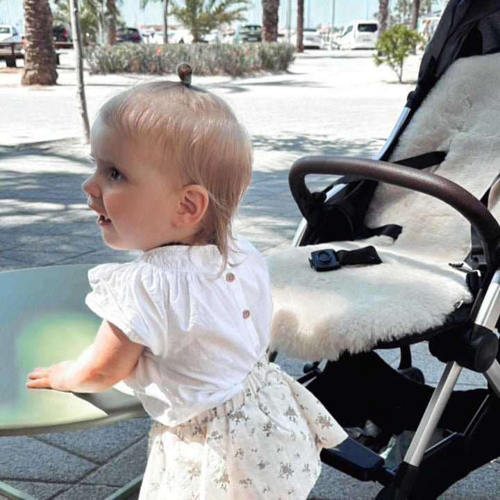 sheepskin liner in pushchair on holiday to cool the pram in warm weather