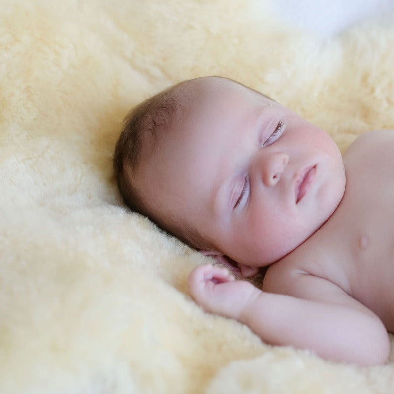 Sheepskin Shown Supporting Baby Sleep and Adding Comfort