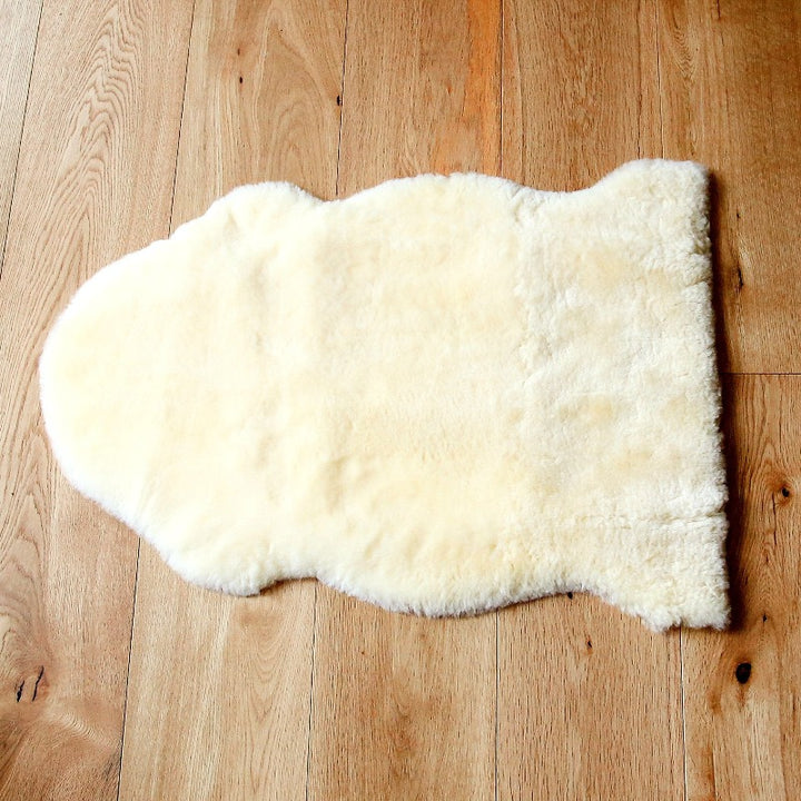 Neutral Sheepskin Rug with Shorn Pile for Tummy Time and Playtime in Baby Nursery