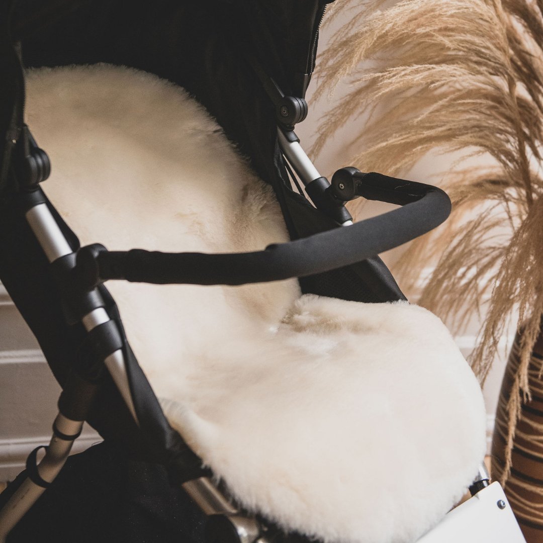 Sheepskin Pram and Buggy Liner to add comfort and softness to a pram shown here in a mountain buggy pram seat