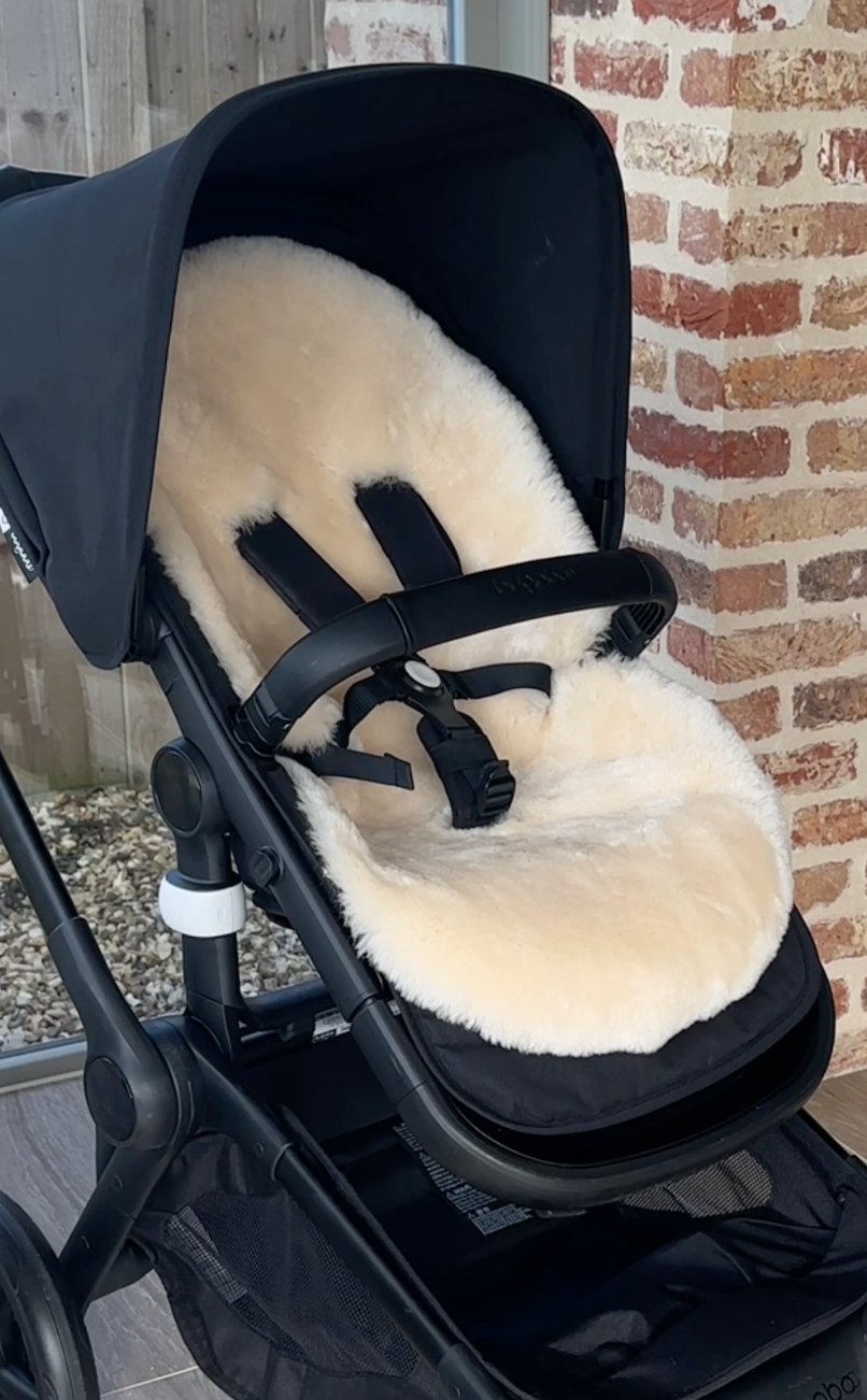 Sheepskin pram liner in a bugaboo fox 5 buggy showing the perfect fit and luxury comfort layer for a baby 