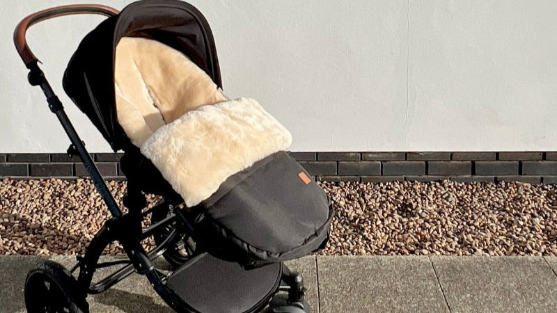 Luxury milk merino sheepskin lining fitting in a cybex or bugaboo pram to keep your baby warm and cosy in the cold
