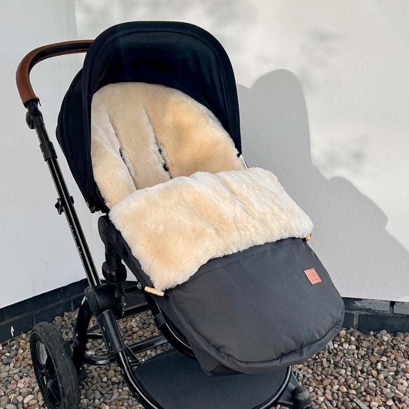 Luxury sheepskin footmuff, baby safe, fully lined and best premium buy for baby, independently tested and reviewed, shown in a pram seat
