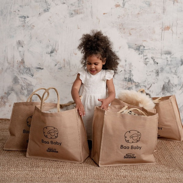 baby safe sheepskin rug and pram liner in a cotton and jute premium shopper bag