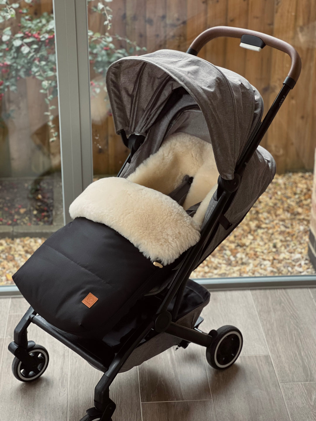 Sheepskin pram footmuff shown in the Joolz Aer Plus compact pram, offers a luxury breathable lining of lambskin to keep baby warm and cosy and the top zips off to leave a pram liner in the summer months