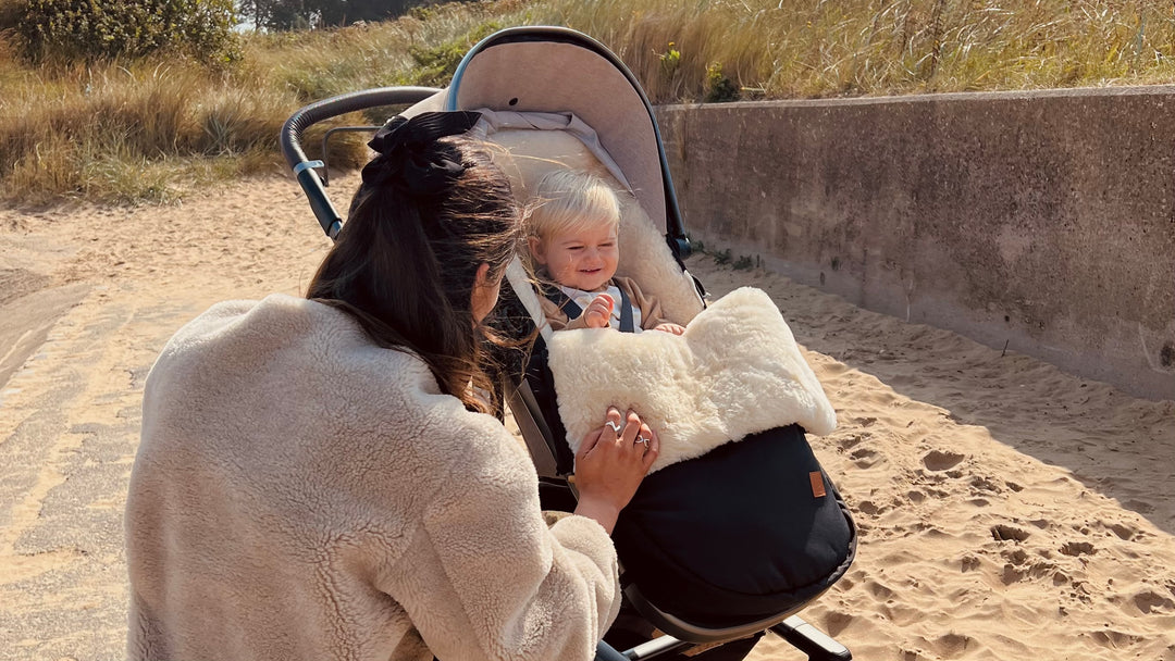 Sheepskin buggy puffmuff and cosytoes with luxury milk lambskin lining shown in a cybex pram