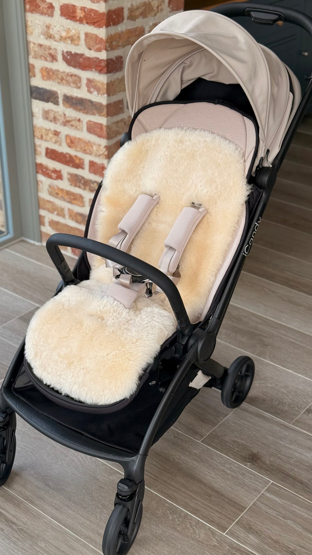 Sheepskin buggy liner shown in the icandy pip travel pram