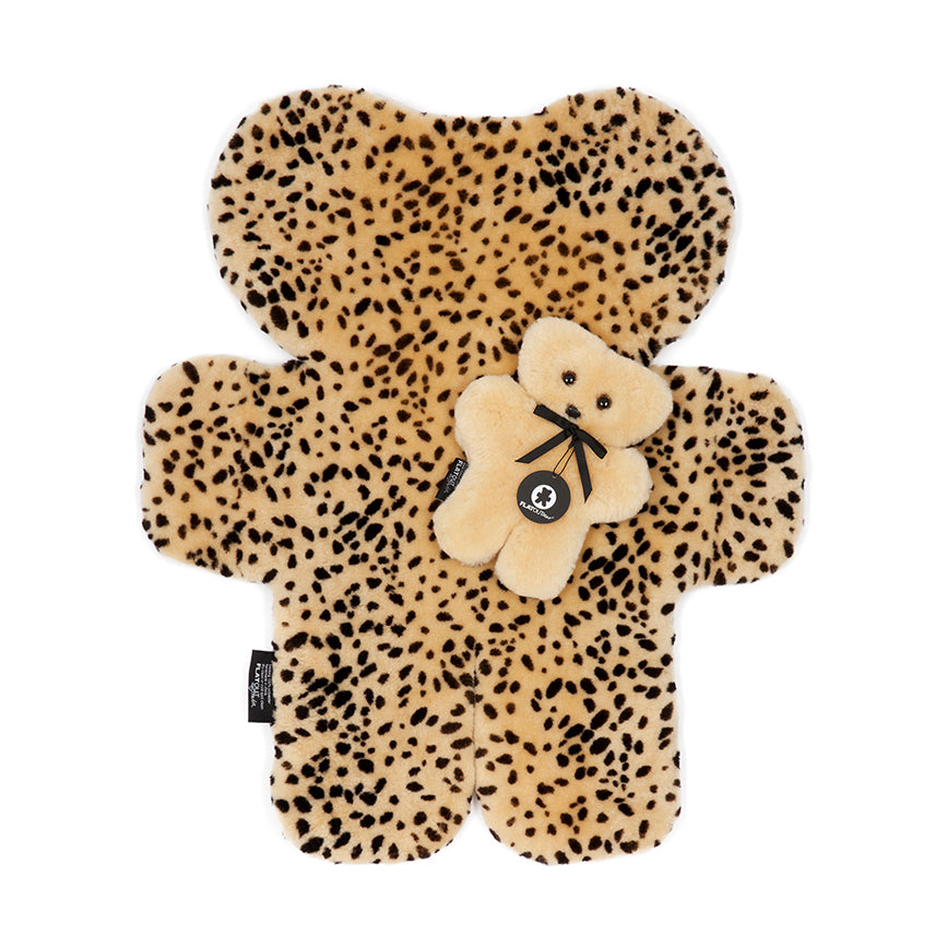 Sheepskin leopard print baby rug for newborns, toddlers and in the nursery or playroom.  Natural and sustainable, shaped in the traditional bear shape of FLATOUT with a honey baby bear on top of it 
