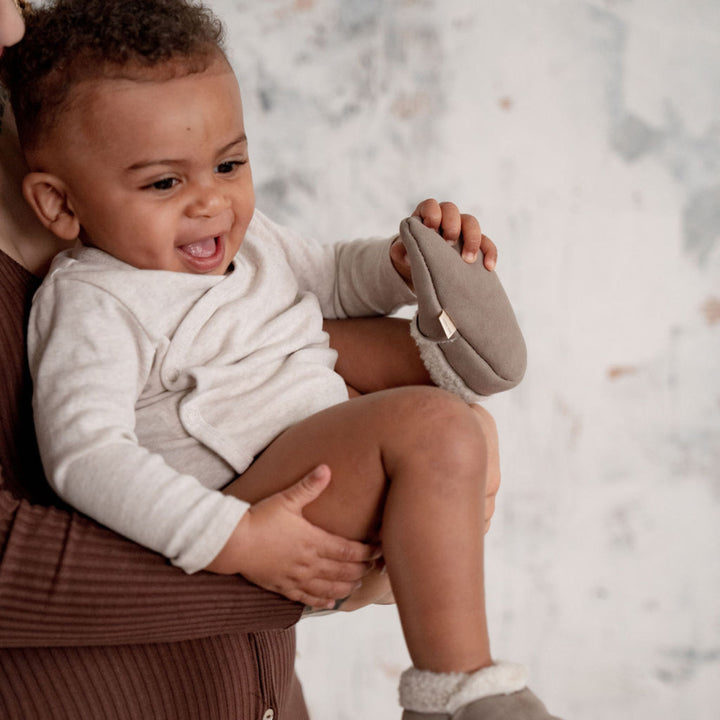 Baa Baby Lambskin Booties Grey on baby's feet, soft soled nappa sheepskin with elastic cuff to stay on baby feet
