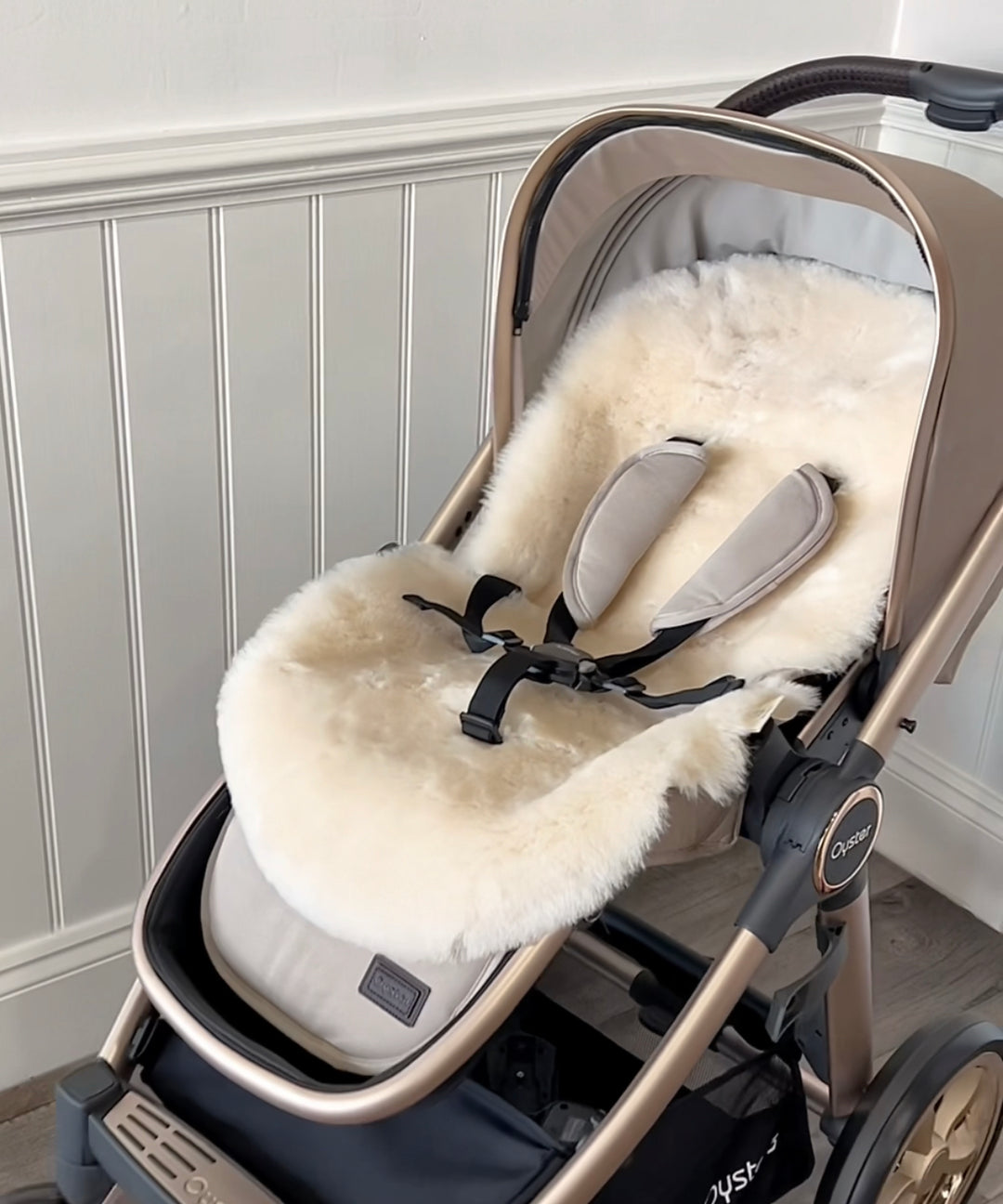 Sheepskin pram style liner in a neutral beige colour in the oyster pram