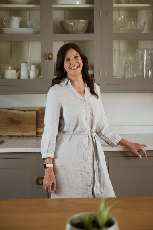 Female founder and owner of Baa Baby a specialist sheepskin baby brand hand cutting luxurious pram liners to settle babies