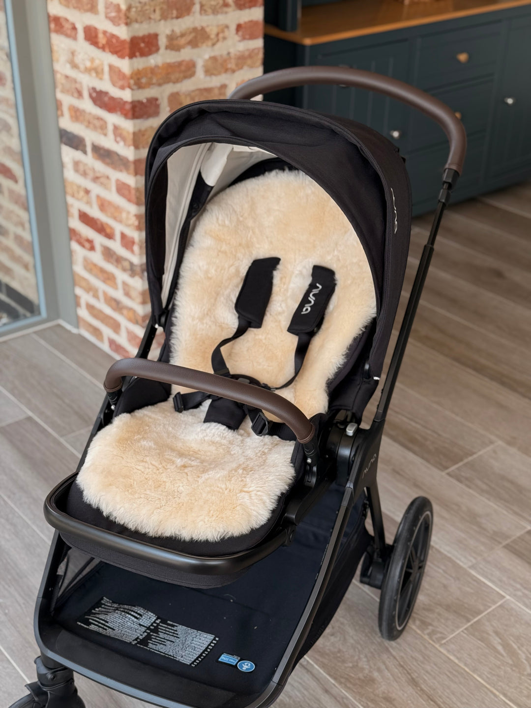 Nuna triv pram with a sheepskin liners