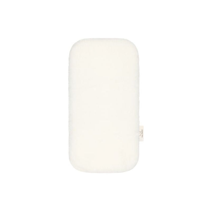 Baa Baby bassinet liner in a creamy milk colour
