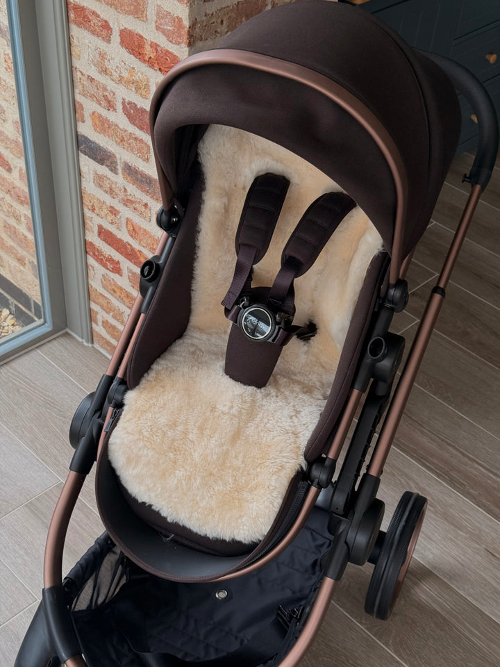 Sheepskin buggy liner in the iCandy peach pram