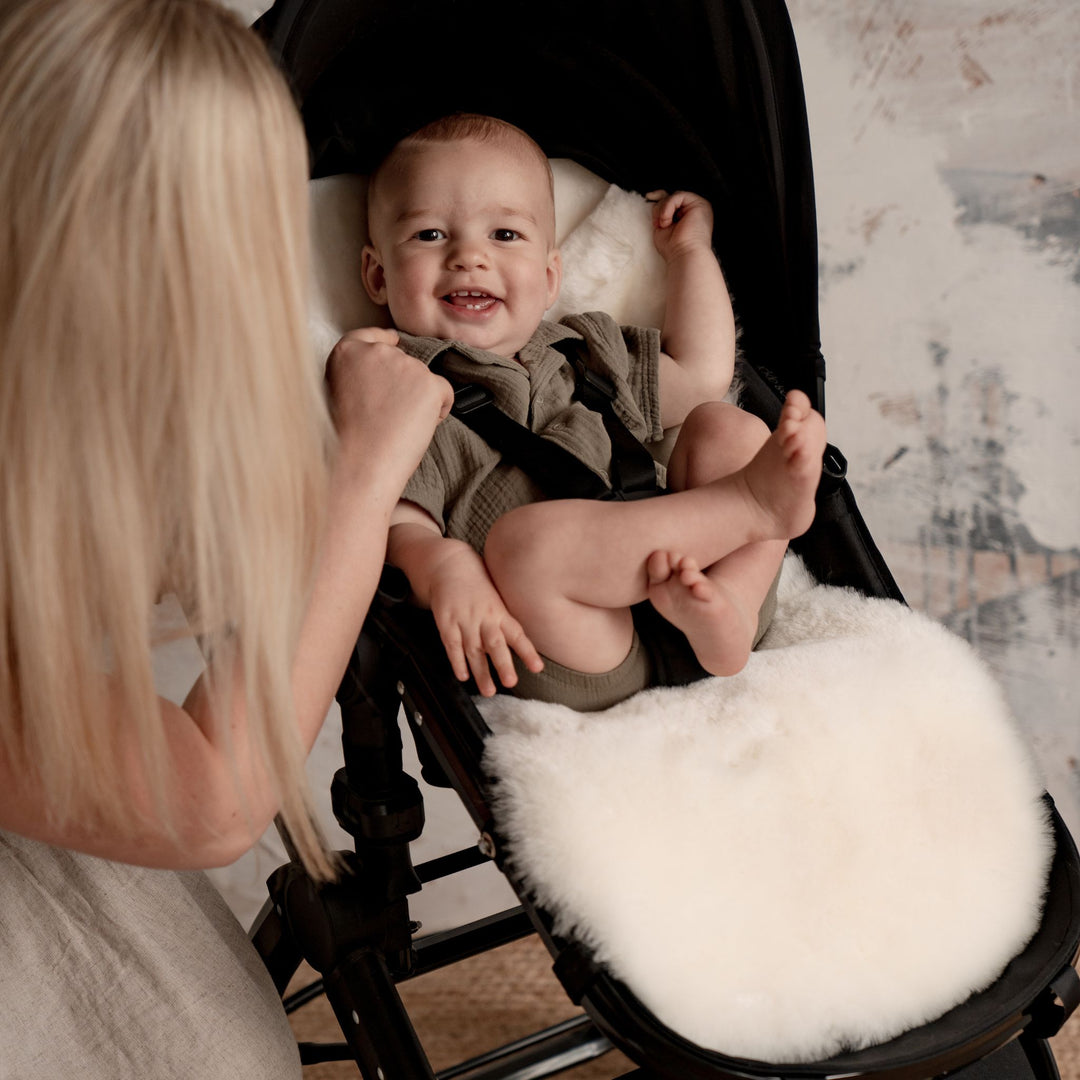 Baby Toes Comfortable on Soft and Sustainable White Shorn Sheepskin Buggy Liner