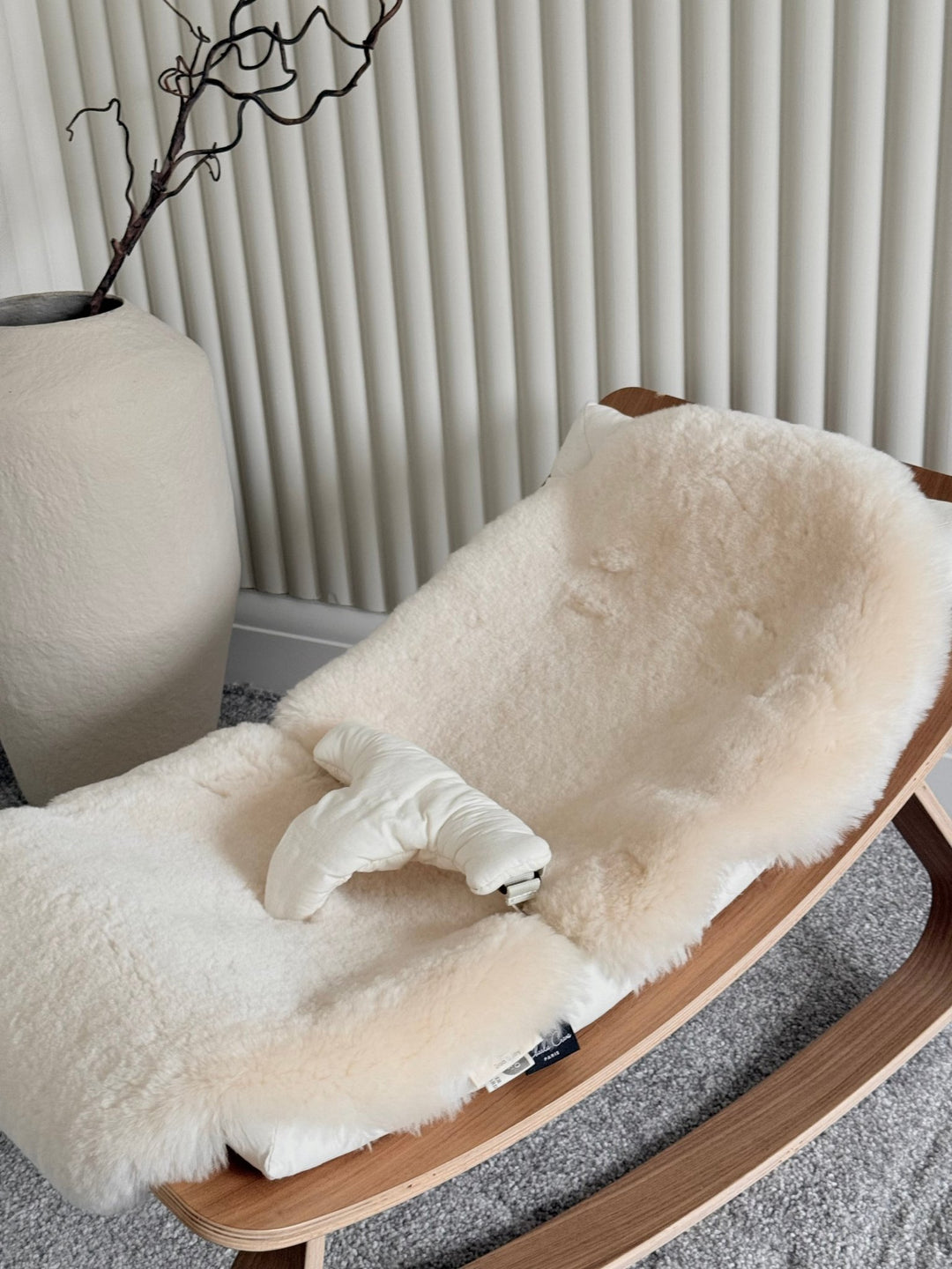 milk neutral pram liner in a charlie crane rocker