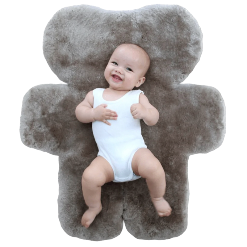 Baby Laying on Australian Sustainable Sheepskin FLATOUT Bear Rug in Brown Latte for tummy time or sleep