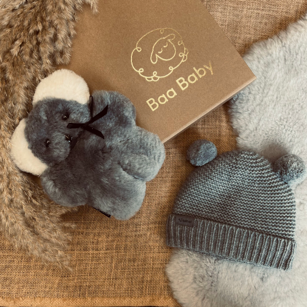 Baby shower gift box with koala flatout sheepskin bear and grey merino wool hat for baby
