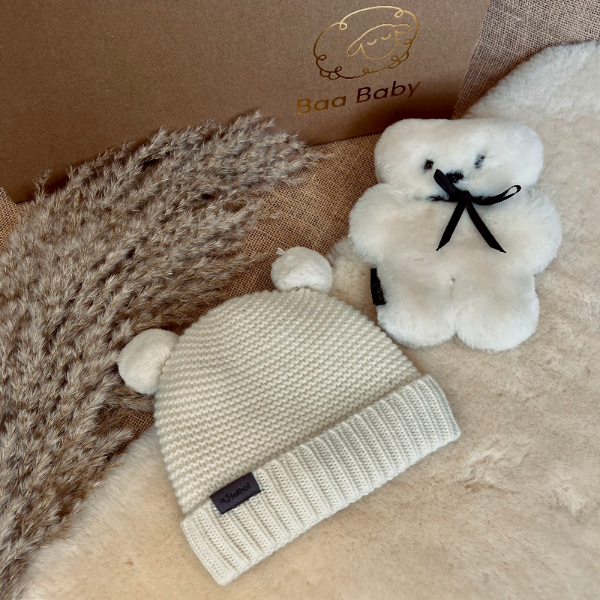 Gift box with cream bobble hat for babies and toddlers and cuddly flatout bear 