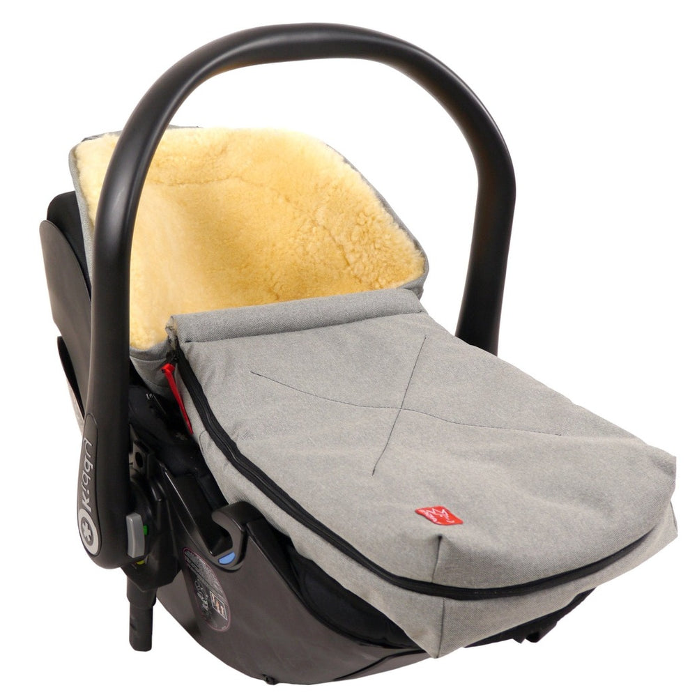 Portable Kaiser Emma Sheepskin Footmuff Shown Fitted Comfortably in Car Seat