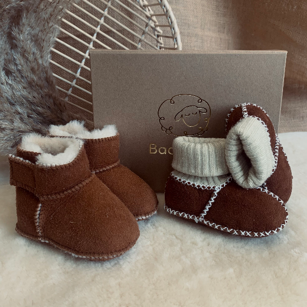 Baby gift box with two pairs of sheepskin booties